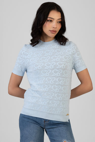woman wearing a light blue lace knit top with short sleeves and ribbed hem by Blue Jean Traders