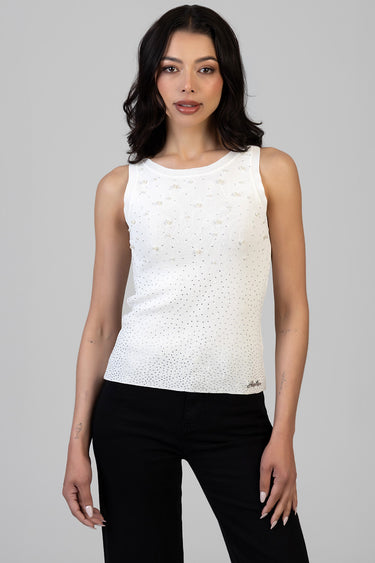 white sleeveless knit top with pearl embellishments and a dotted gradient worn by a female model