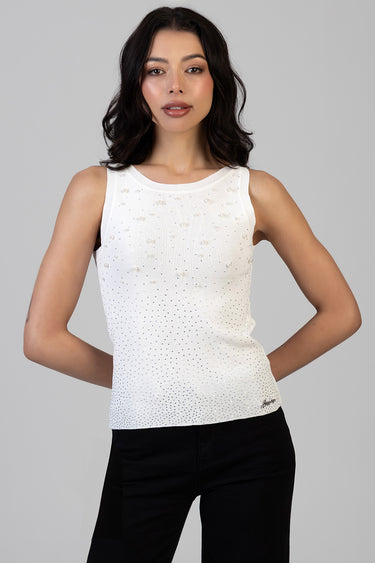 white sleeveless knit top with pearl beads and a dotted gradient on a model by Blue Jean Traders