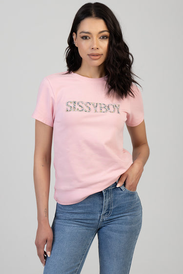 pink short sleeve crew neck t shirt with sparkling lettering across the chest, worn by a model in blue jeans.