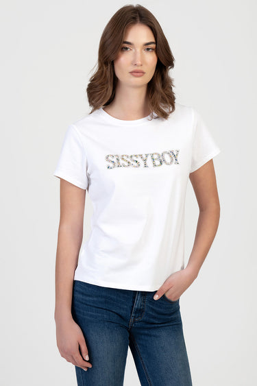 woman wearing white short sleeve crew neck top with glitter logo reading SISSYBOY, paired with dark blue jeans