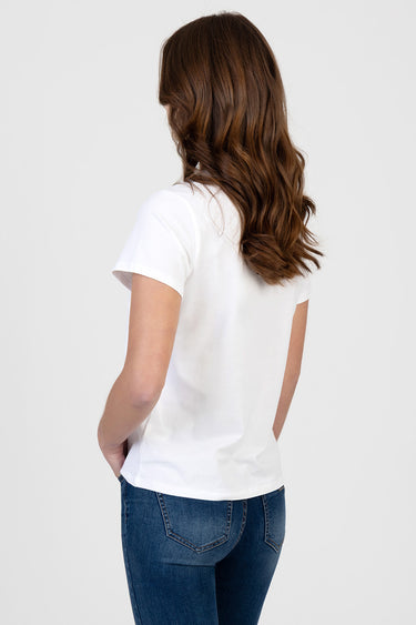 back view of a white short sleeve top paired with blue denim jeans