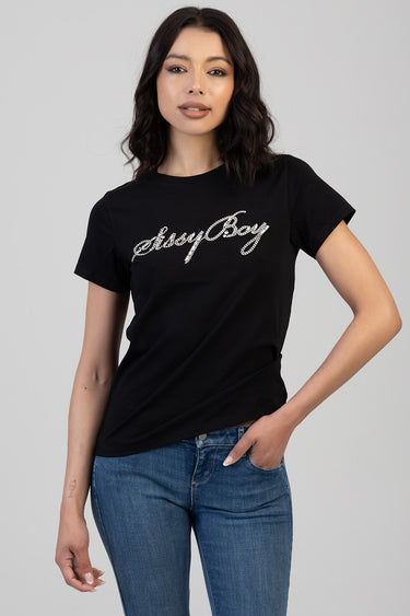 woman wearing a black short sleeve t shirt with a rhinestone script graphic across the chest and blue denim jeans