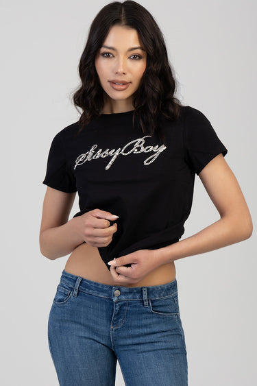 woman in a black short sleeve t shirt with silver rhinestone script across the chest, tied at the hem, wearing blue jeans