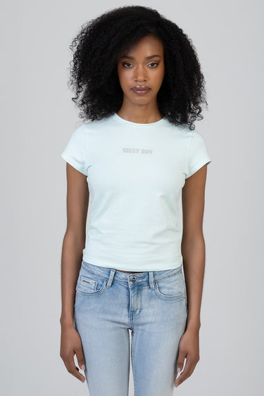 model wearing light pastel blue short sleeve crew neck t shirt by Blue Jean Traders with small embroidered text on the
