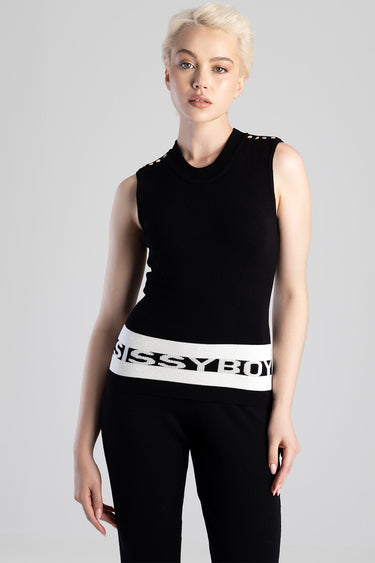 model wearing a black sleeveless knit top with studs on the shoulders and a white logo waistband.