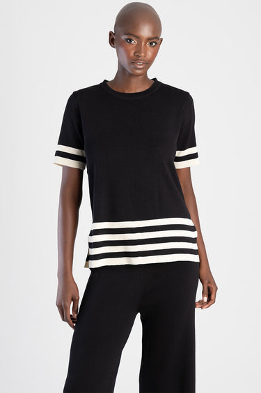 black knit top with white striped trim on sleeves and hem, crew neck, short sleeves, relaxed fit