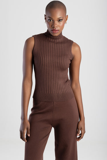 model wearing brown ribbed sleeveless turtleneck knit top with matching brown knit pants