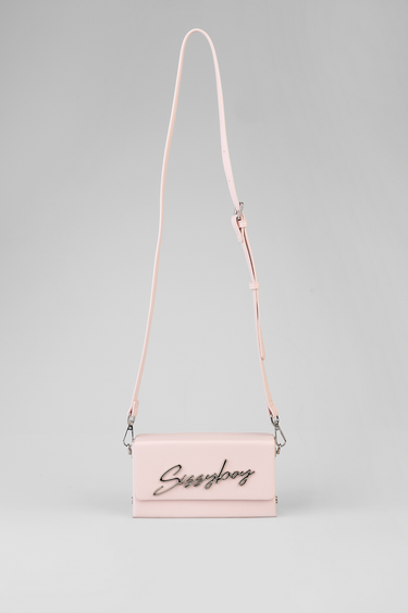 pink rectangular crossbody bag with long strap and silver script logo on front