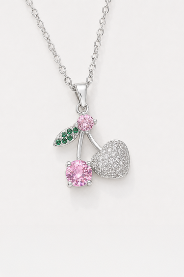 silver chain necklace with a cherry pendant, pink gemstones and a pavé heart