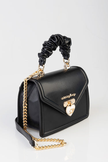 black structured handbag with a ruched leather handle, gold chain strap and heart lock detail