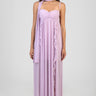 woman in lavender maxi dress with ruched bust, halter straps and long scarf around neck, cascading ruffle details along front