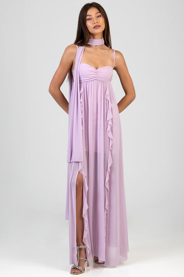 model wearing a lavender maxi dress with ruched bodice, thin straps and long cascading ruffles, plus a matching scarf
