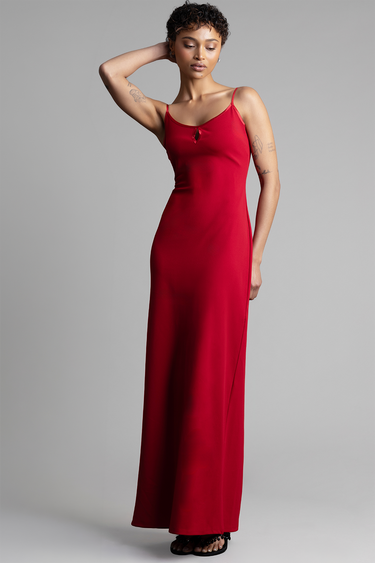 model in a red maxi dress with thin spaghetti straps and a small keyhole neckline