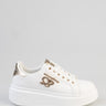 white platform sneaker with a gold metallic heel panel, white laces, and a cursive logo on the side