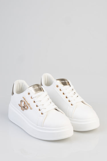 white platform sneakers with gold metallic heel tab, butterfly emblem on the side and white laces