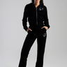 woman wearing black velour track pants and zip hoodie with butterfly embroidery, by Blue Jean Traders